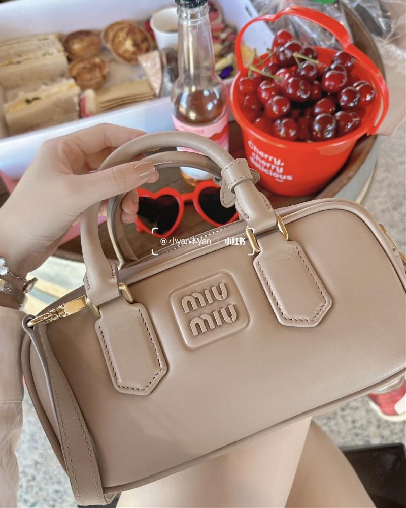 The Miumiu Bowling bag in milk tea color has become the latest musthave accessory in the