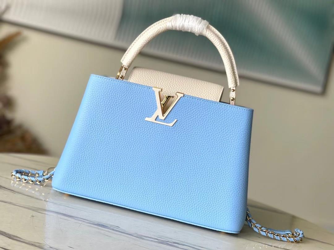 M21887 blue medium size Taurilon leather version of the Capuchines handbag presents a soft and fresh