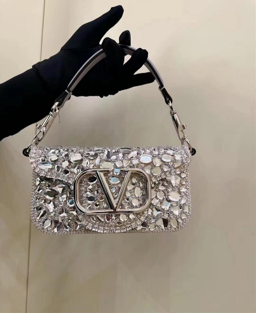 crystal styleThe Valentino Garavani Mini Loc handbag is adorned with crystals and Vlogo Signature ma