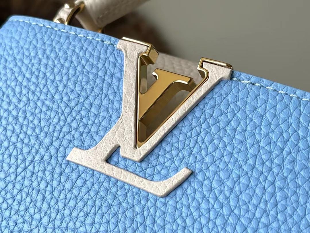 M21887 blue mini Taurilon leather version of the Capuchines mini handbag presents a soft a