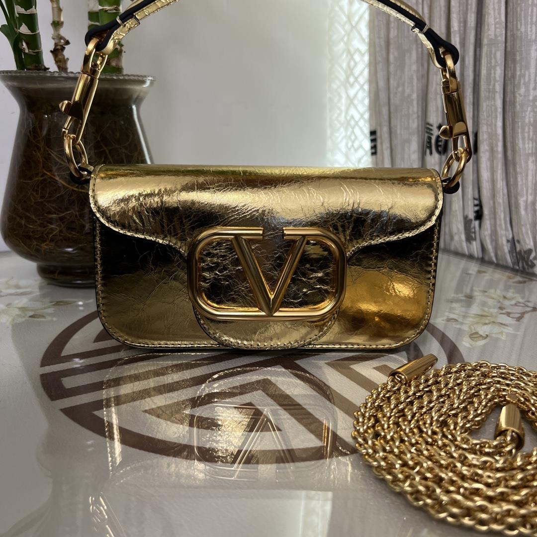 Small Garavani MINI LOC calfskin handbag with metal VLogo Signature detailsEquipped with detachable 