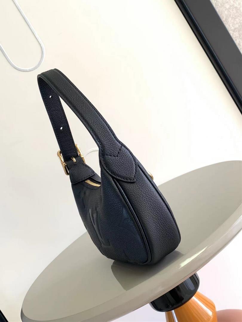 The M82391 M82519 Mini Moon handbag is made of soft Monogram Imprente embossed leather al