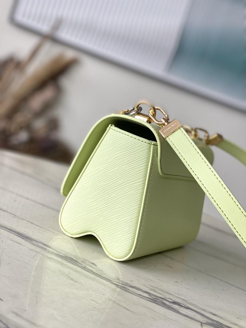 M22768 Apple GreenThis Twist small handbag incorporates the brands iconic Monogram flower