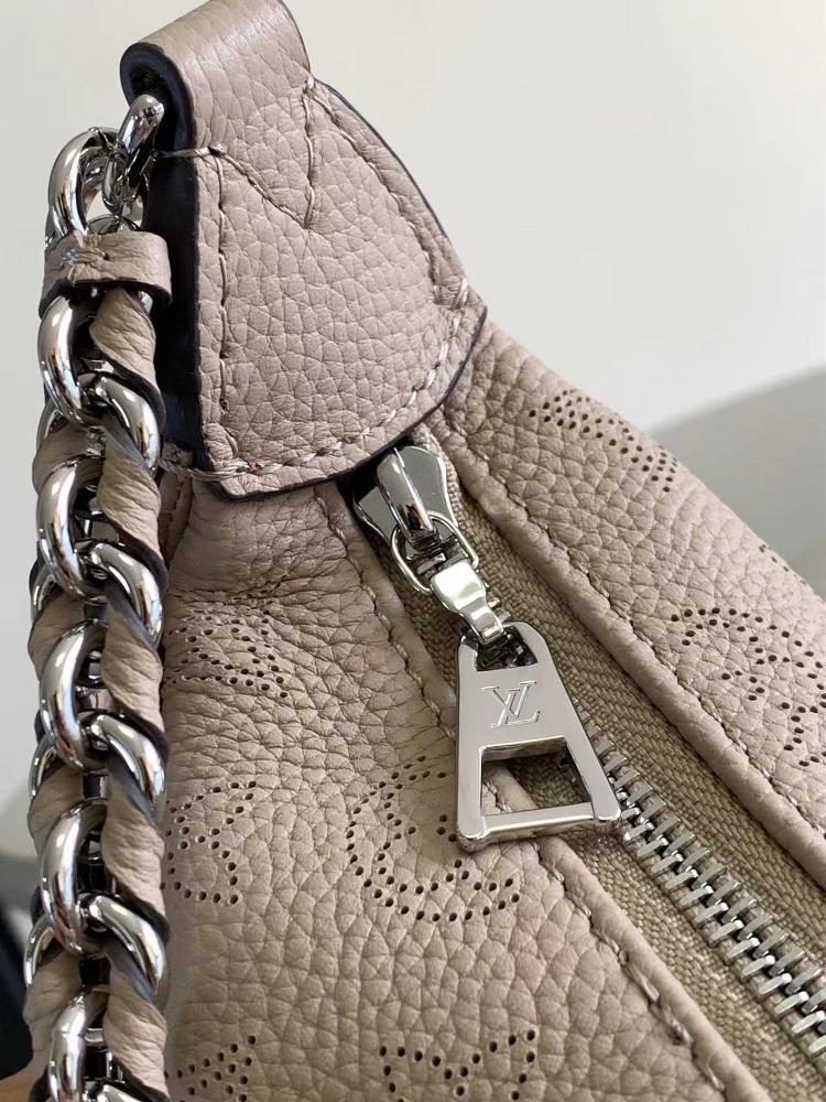 M22822The Baia medium size handbag is made of soft and pendulous perforated cowhide leathe