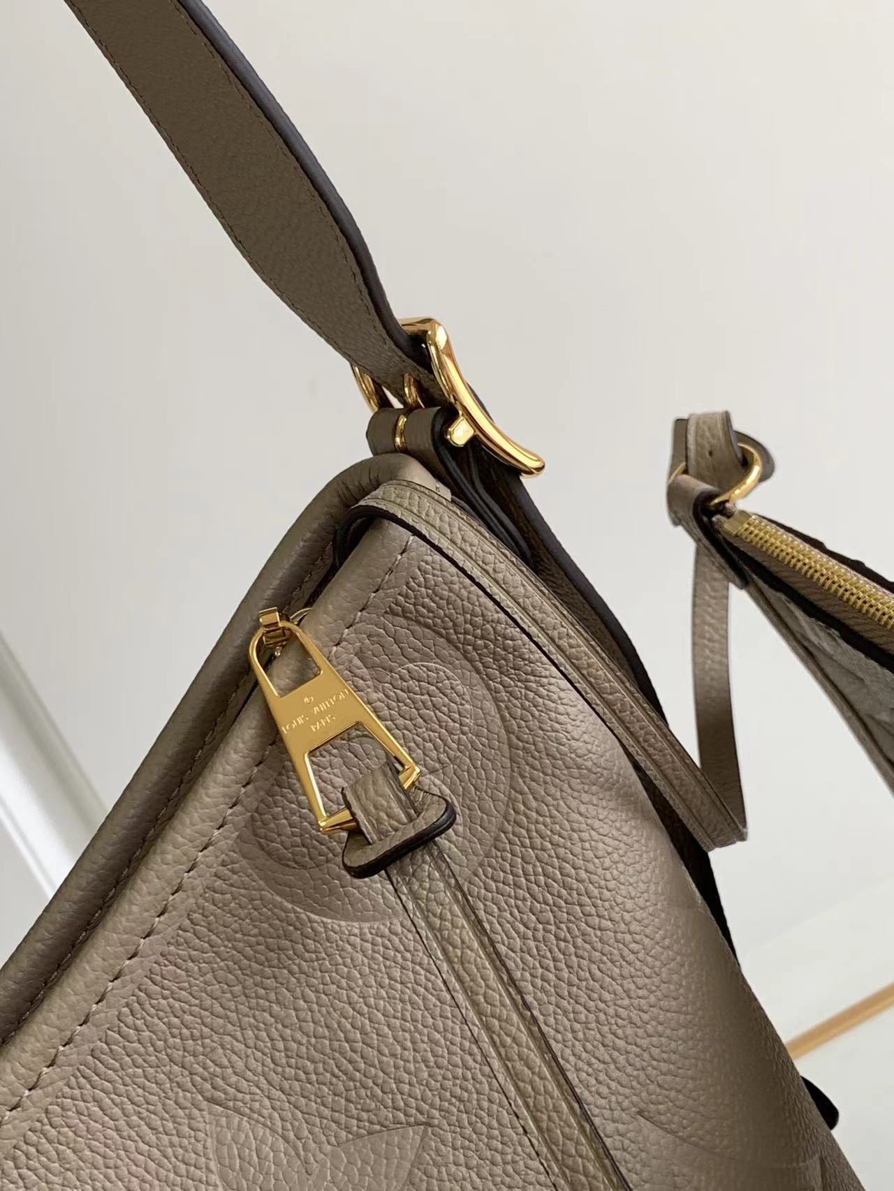 M46288 M46203 matching details CarryAll small size handbag is made of Monogram Imprente emboss