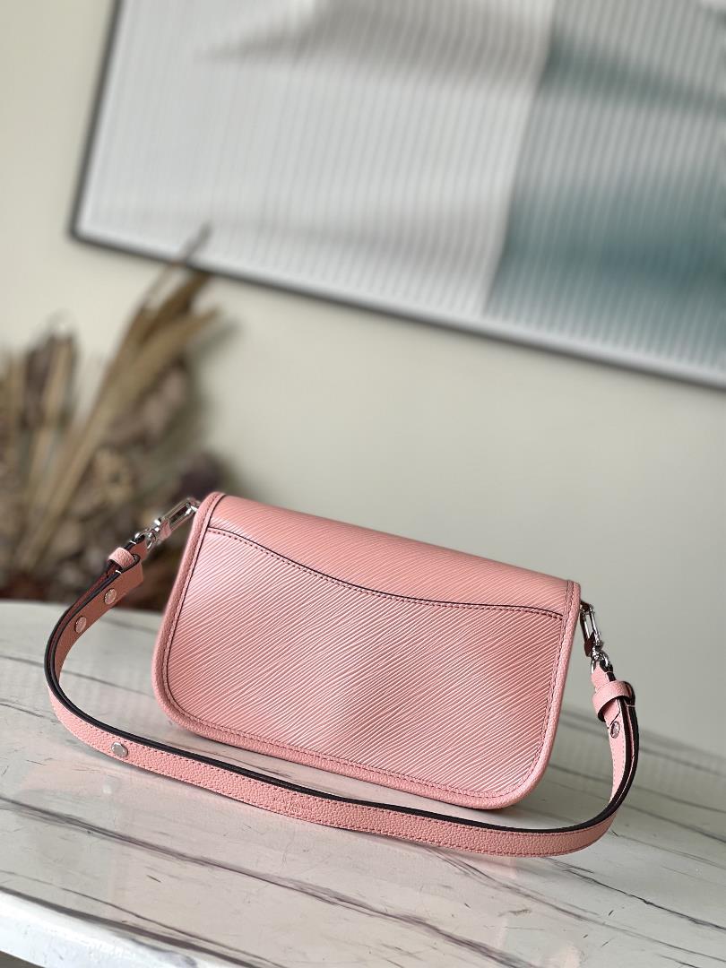 M2098759386 Peach Powder is a Buci crossbody bag made from iconic grain grain Epi leather This