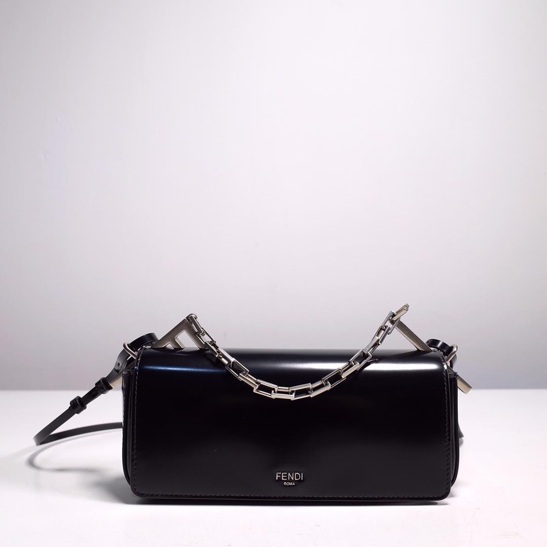 The FENDI handbag is made of black brushed leather material decorated with large F metal accessories