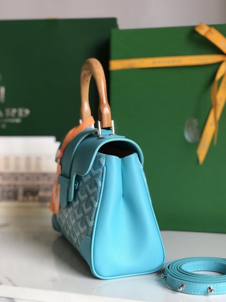 The Goyard bag in Turquoise Blue specifically the Sagon mini bag is the epitome of perso