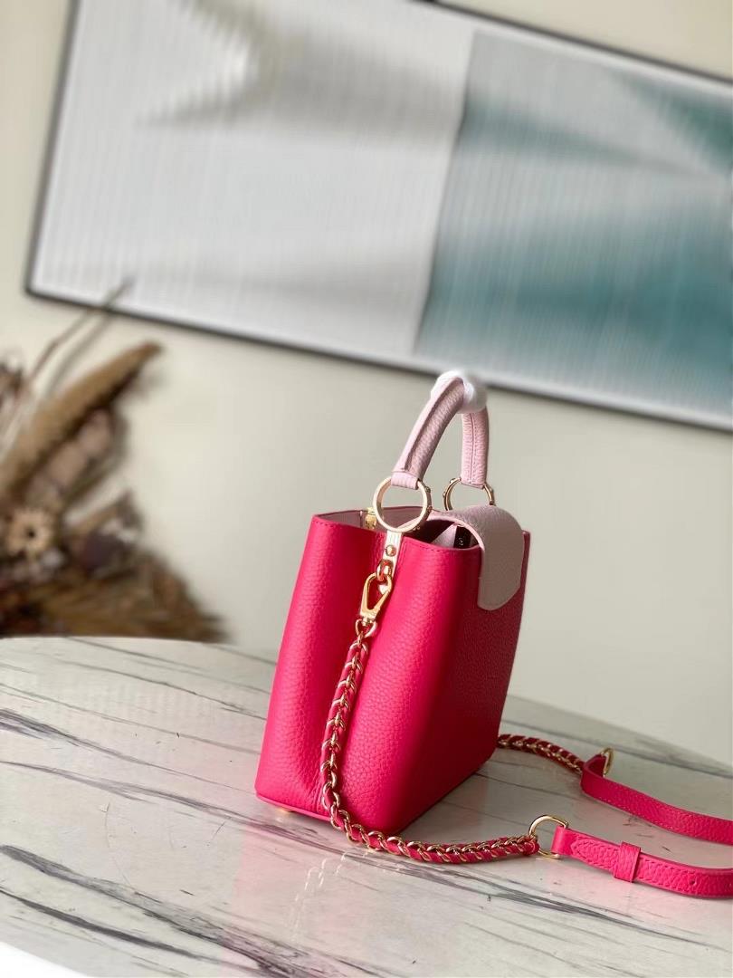 The toplevel original M21689 pink small size Taurilon leather version of the Capuchines BB han