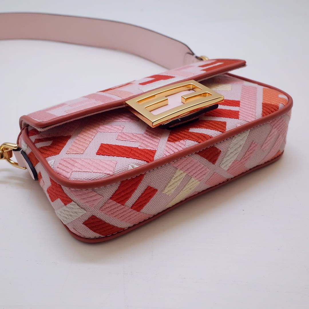 The FEND1 iconic Baguette handbag is made of canvas material and is adorned with red and pink 