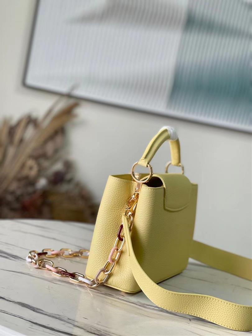 Top of the line original M21798 yellow small size This Capuchines small size handbag is made o