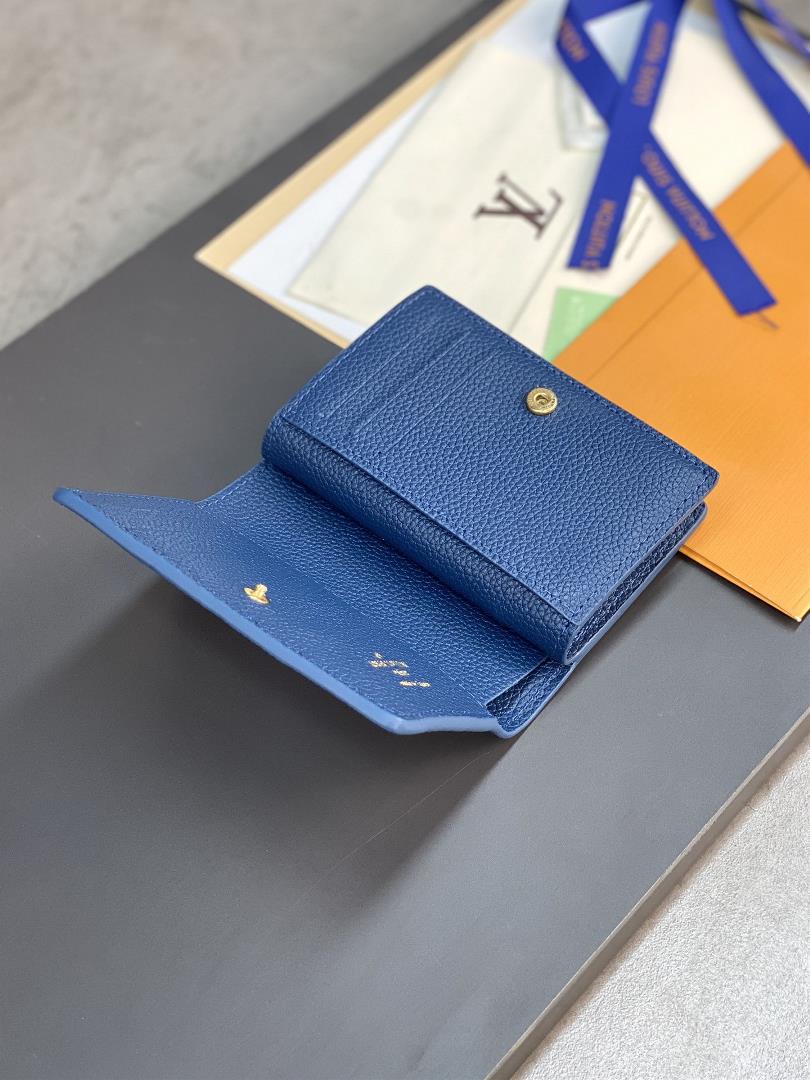 The M82329 blue screen printed Cla wallet is made of Monogram Imprente soft grain cowhide