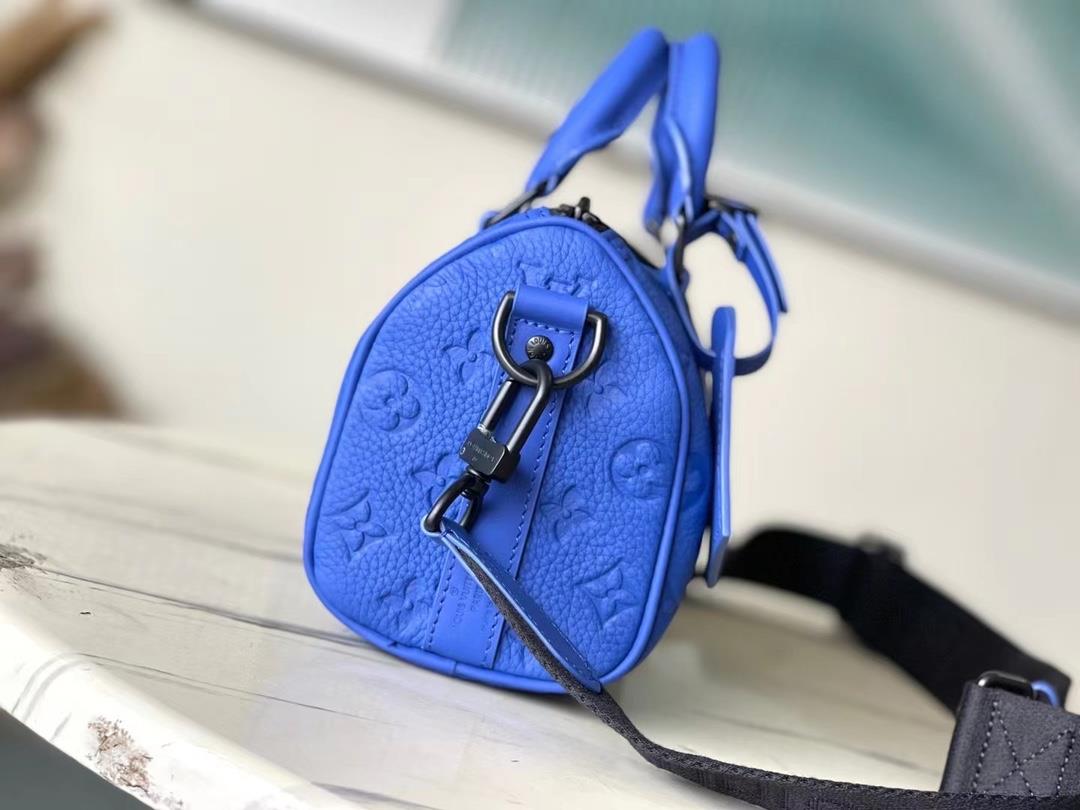 The toplevel original M23129 blue Keepall Bandoulire 25 handbag features Monogram embosse