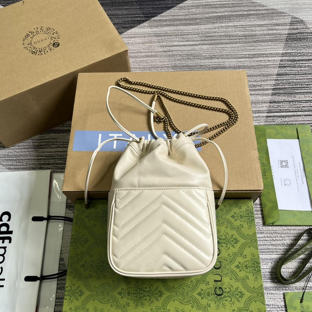 mini bucket bag is crafted with white quilted Vshaped leather As a iconic element of the GG Ma