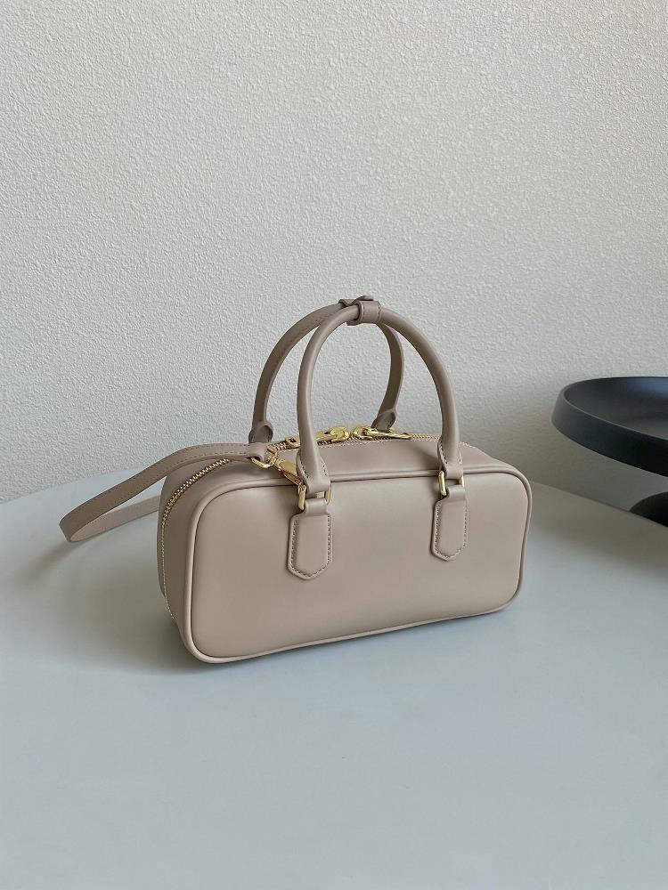 What I love most about the Miumiu Bowling bag is its versatility It can effortlessly tran