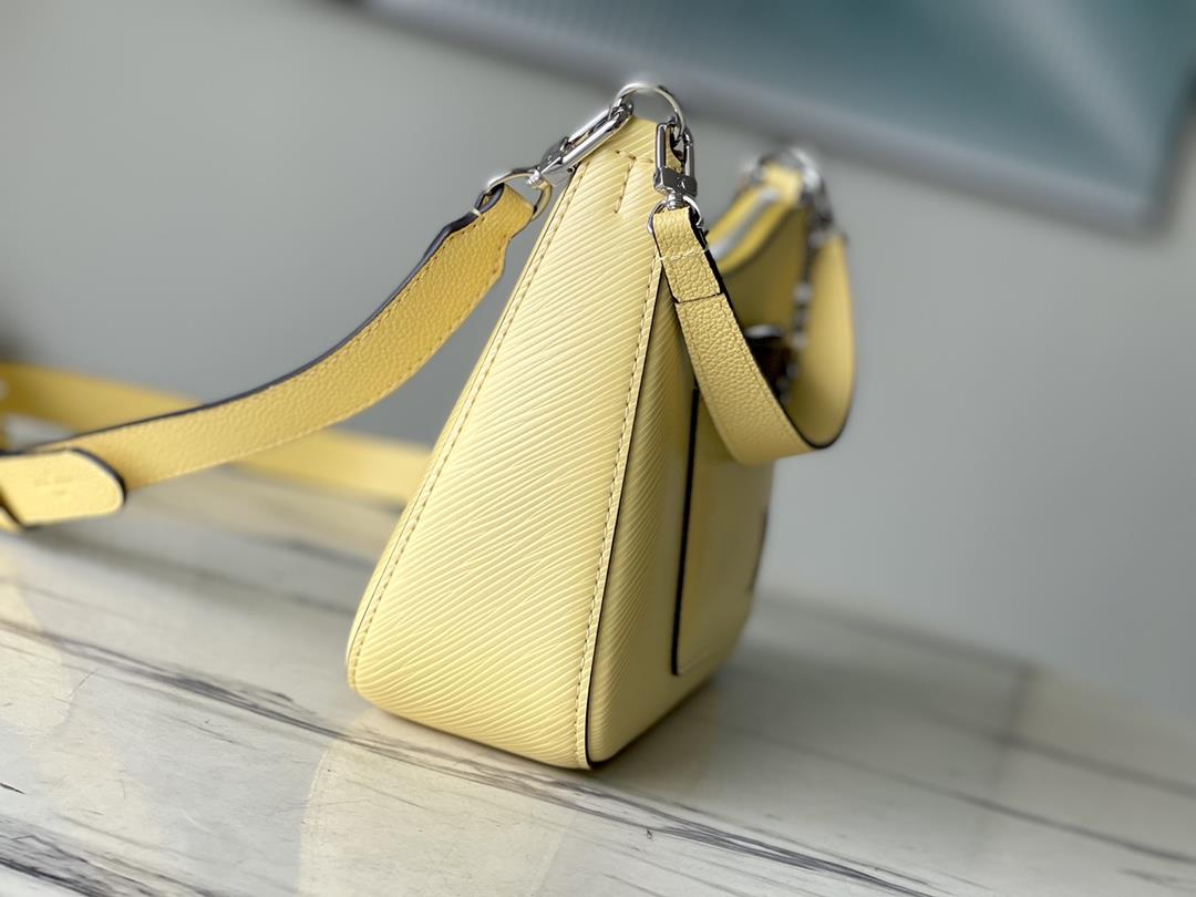 The M22215 Chicken Yellow Marelle handbag is crafted with elegant Epi grain leather to create 