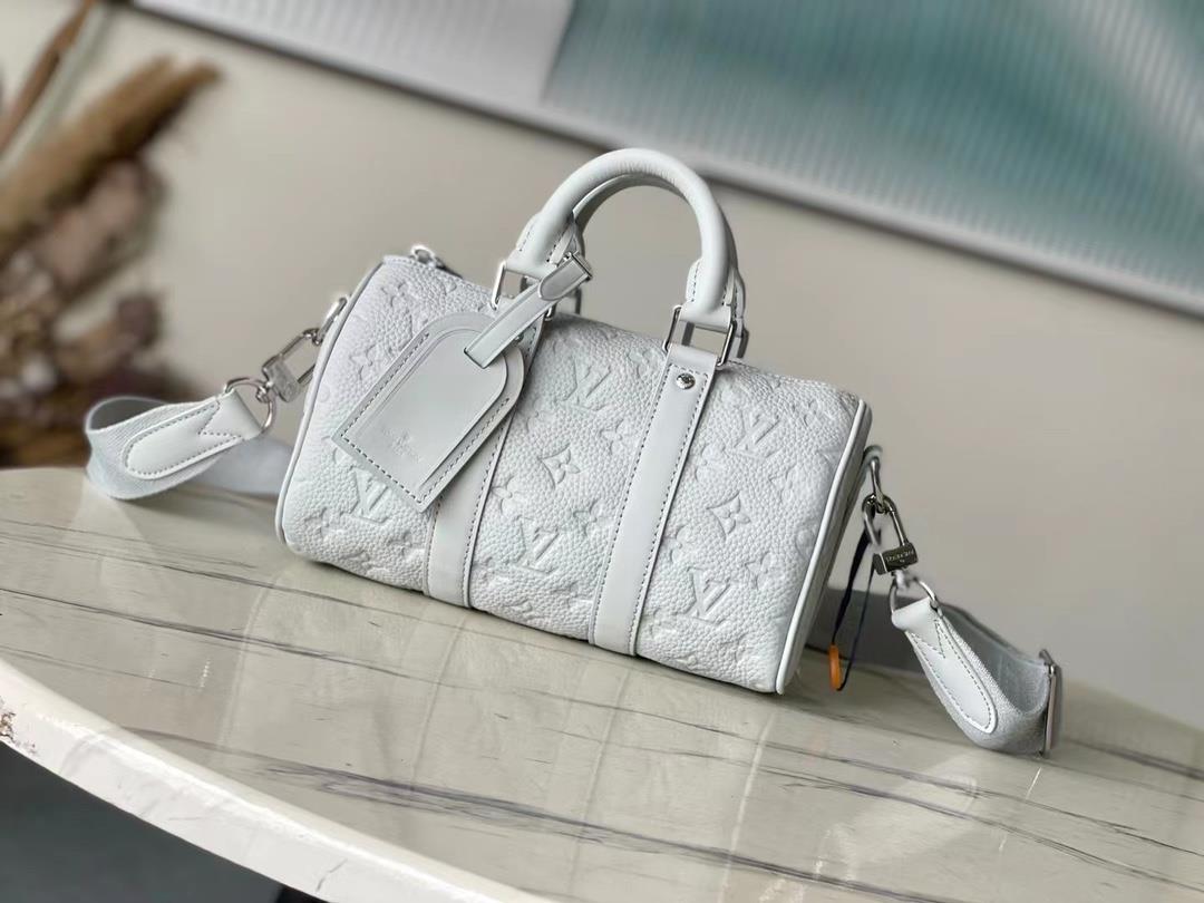 The toplevel original M23129 gray Keepall Bandoulire 25 handbag is made of Monogram embossed grain