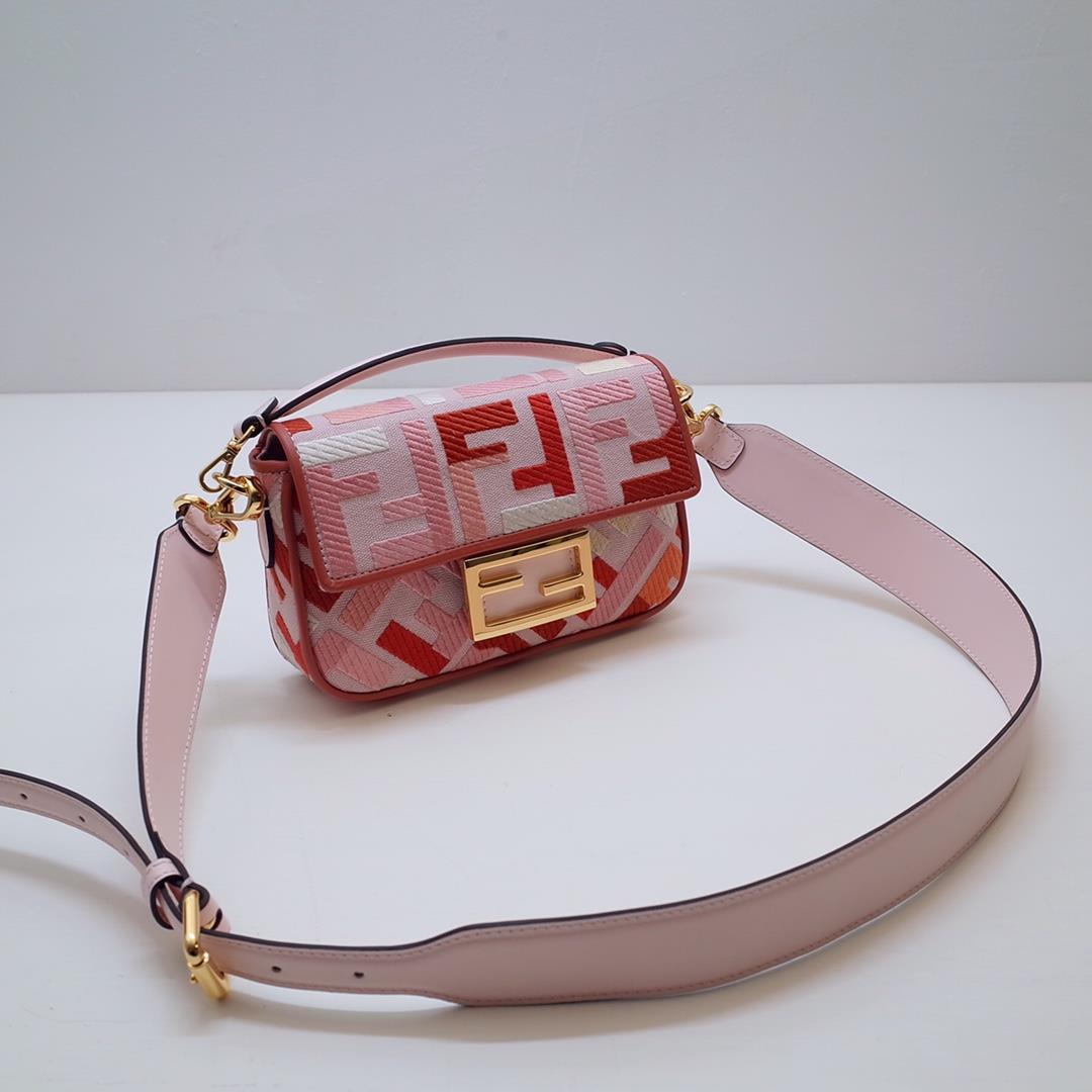 The FEND1 iconic Baguette handbag is made of canvas material and is adorned with red and pink 