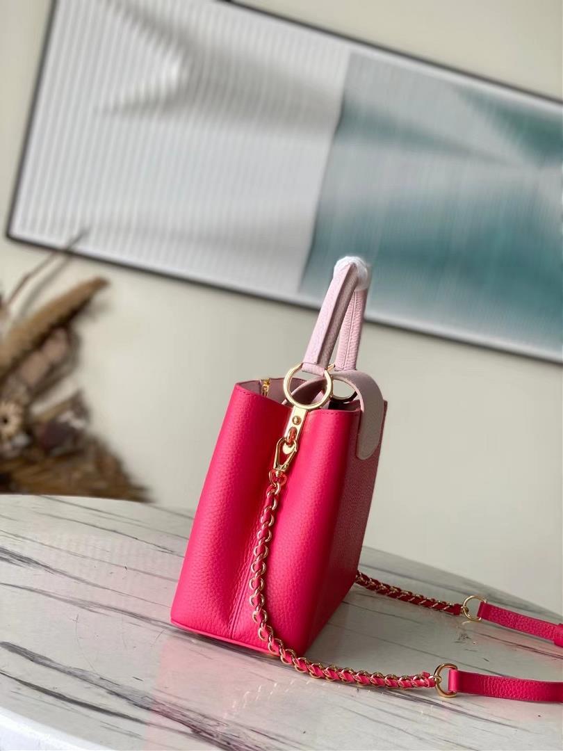 The toplevel original M21689 pink medium size Taurilon leather version of the Capuchines handb