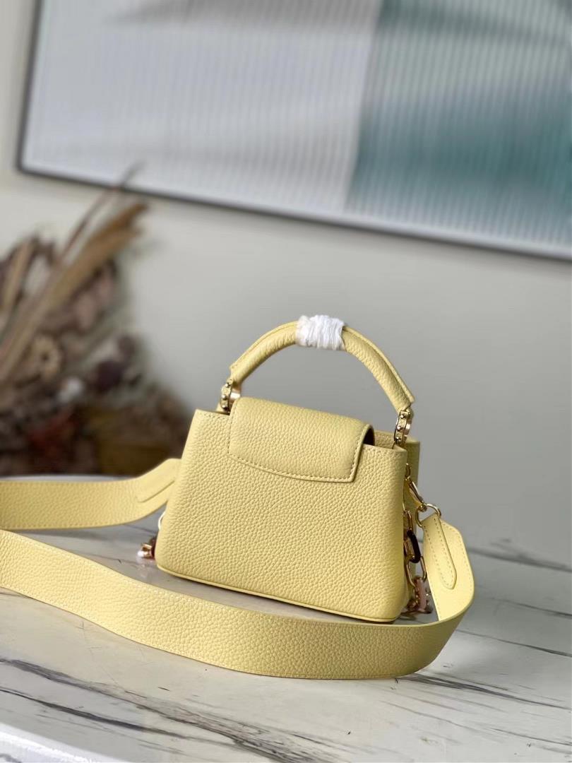 The toplevel original M21798 yellow mini Capuchines mini handbag features metal and resin link