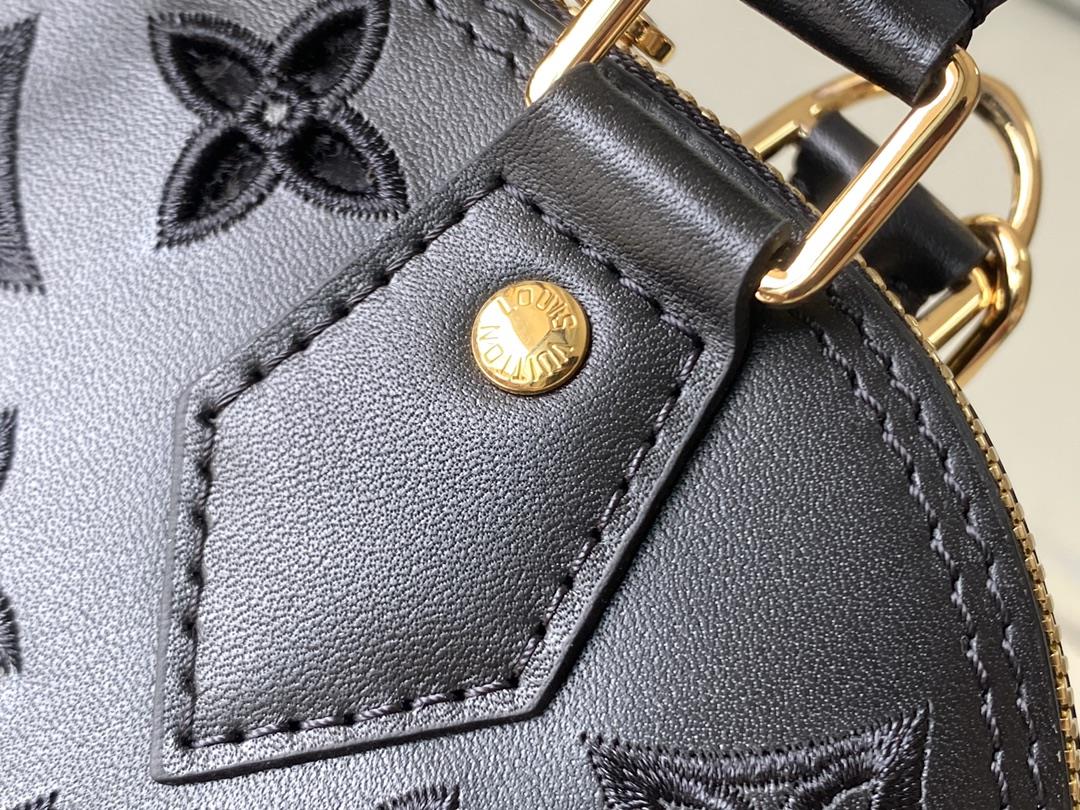 M22878 black 91606 perforated blackThis Alma BB handbag originates from the LV Broderie An