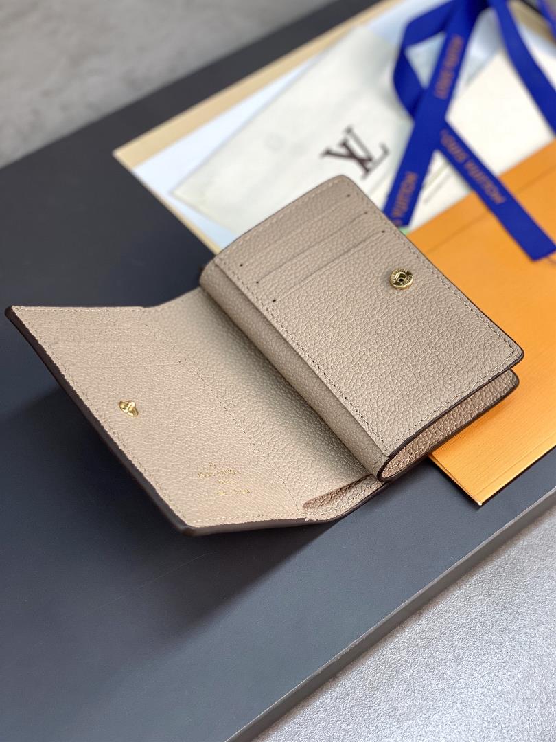 The M82370 Apricot Silk Screen Cla wallet is made of Monogram Imprente soft grain cowhide