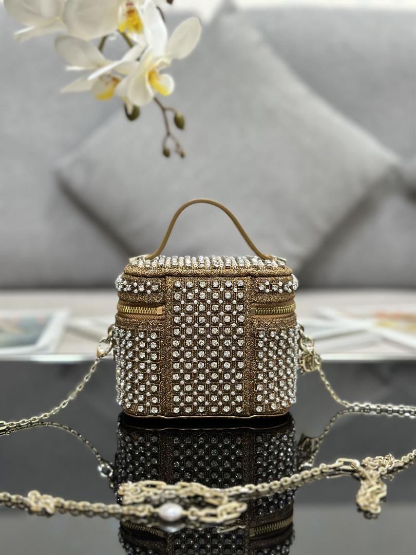 The ultra mini makeup bag Lady Dior Vanity features an embroidered starry white diamond