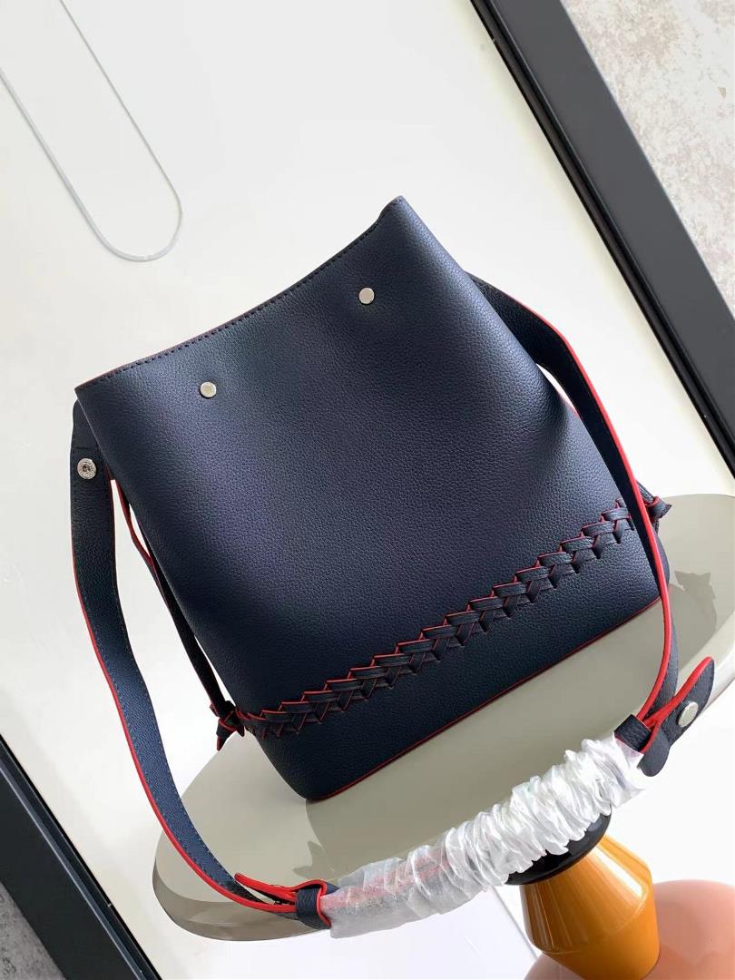 M54677s latest water bucket bag features imported soft calf leather with a shiny twist lo