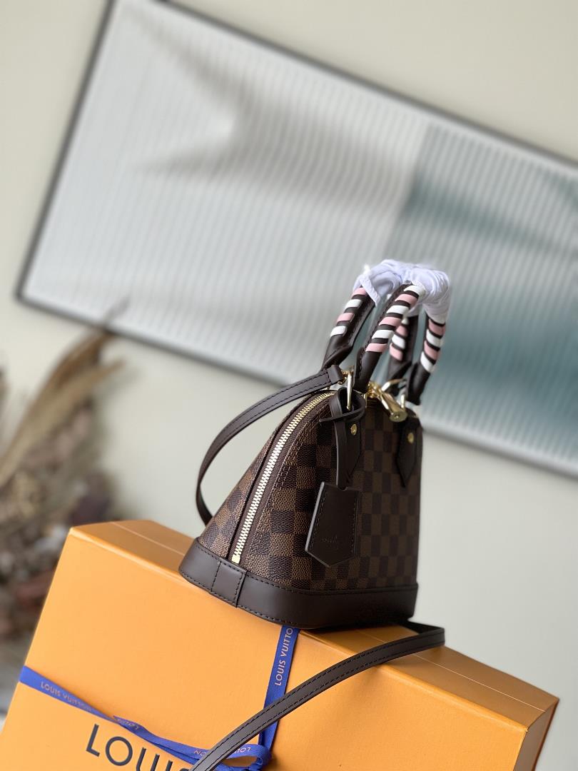 N4044741221 brown plaid weaveThis Alma BB handbag has taken on a new look this season reinterp