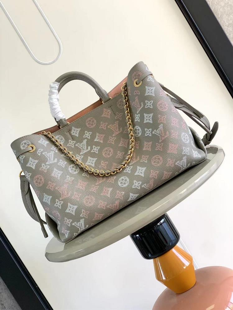 M23395 gray silk screen printed Bella Tote handbag combines a bucket bag and travel bag with perforated cow leather The soft configuration and soft c