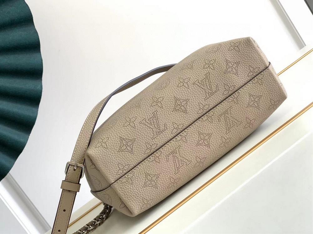 What truly sets the LV M20700 apart from other handbags is its unique knot detail which a