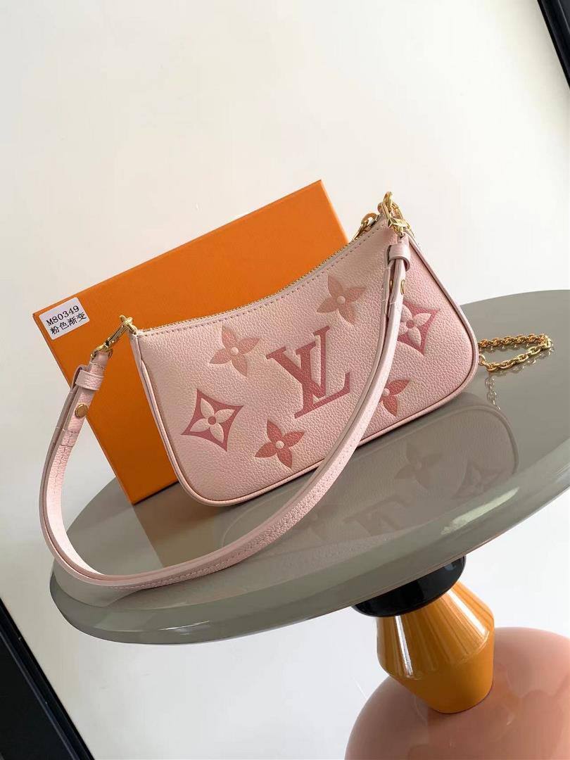 The M80349 M81908 Cherry Blossom Pink Easy Pouch On Strap handbag is made of Monogram Imprente