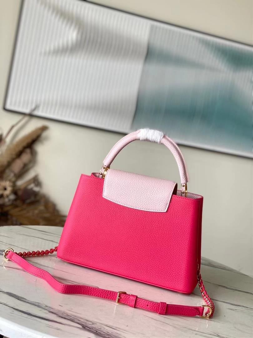 The toplevel original M21689 pink medium size Taurilon leather version of the Capuchines handb