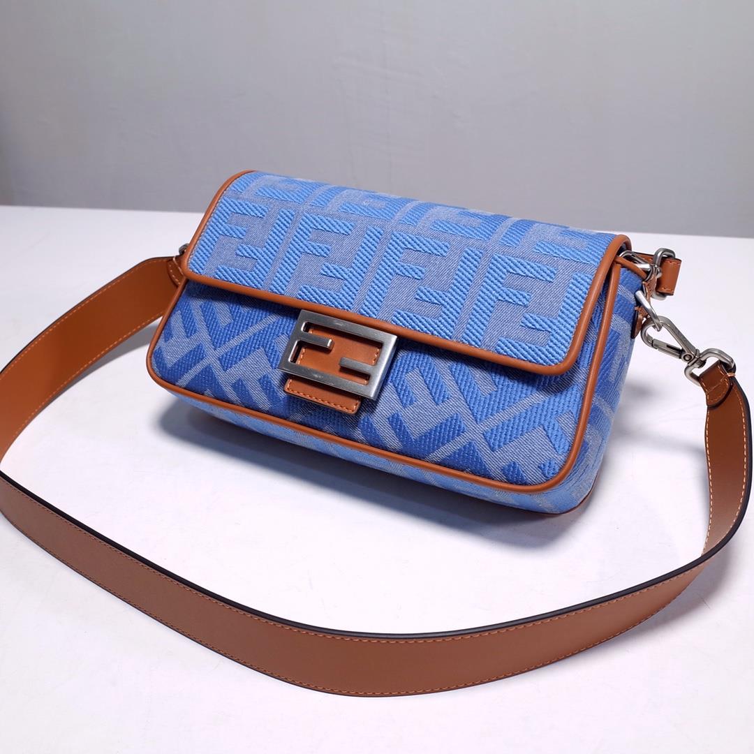 signature Baguette medium handbag made of Baby blue Denim decorated with the same color