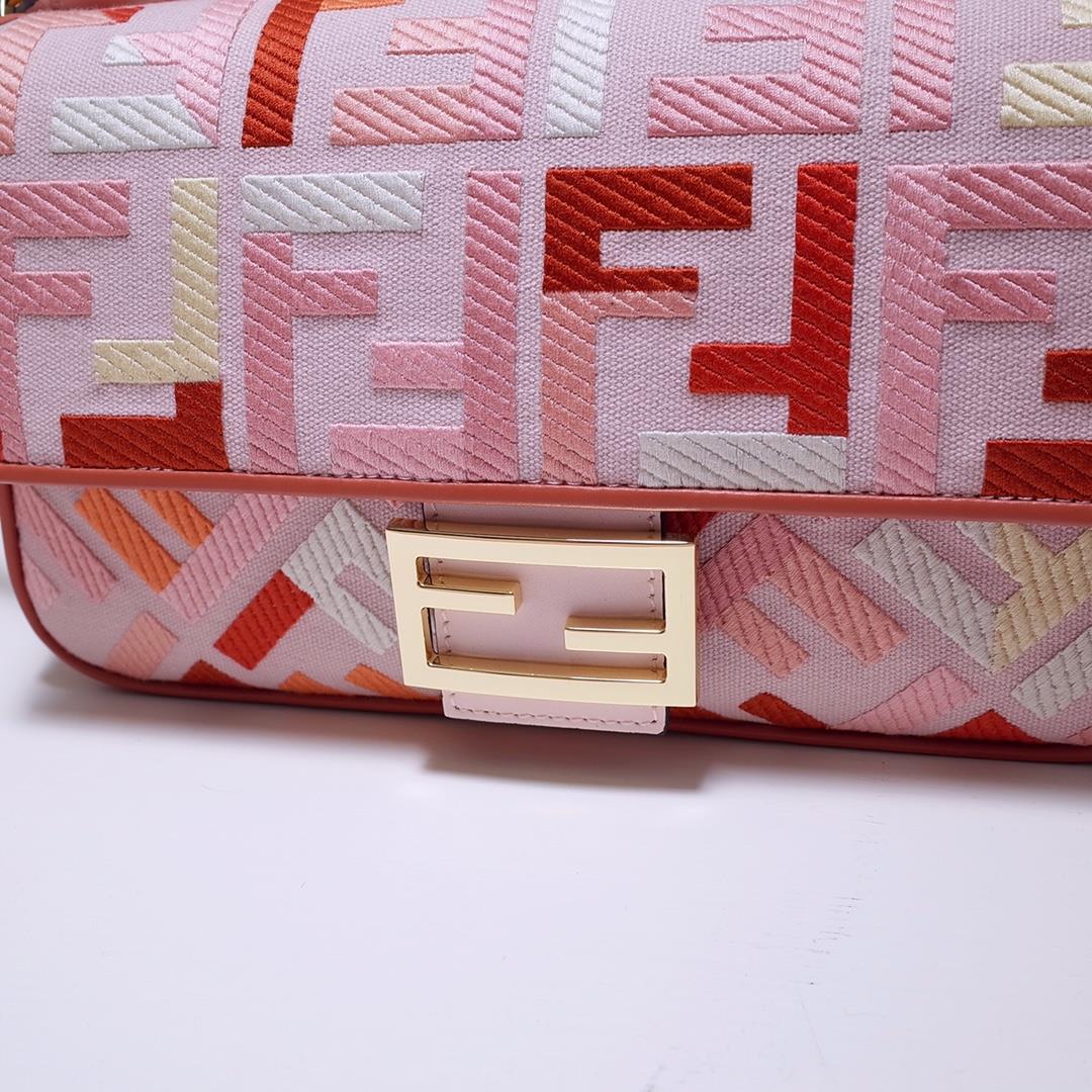 The FEND1 iconic Baguette handbag is made of canvas material and is adorned with red and pink 