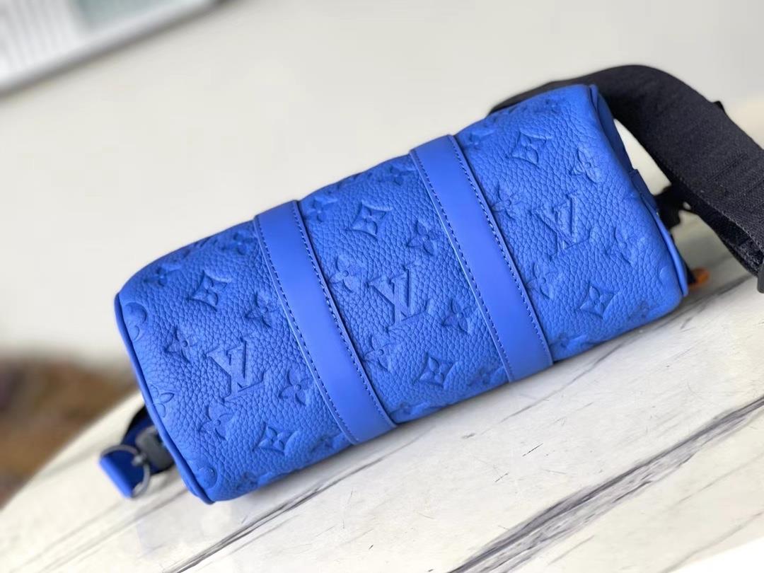 The toplevel original M23129 blue Keepall Bandoulire 25 handbag features Monogram embosse