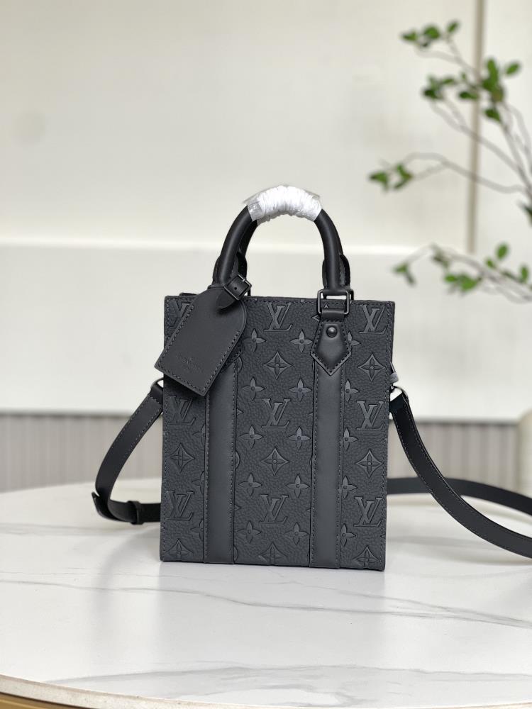 M46453 full leather embossed as a compact version handbag in the Sac Plat series the Sac Plat mini handbag combines Monogram embossed grain Taurillon