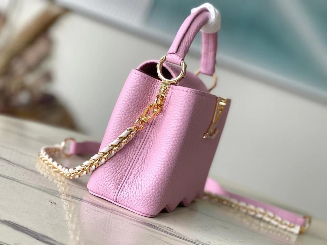 m22122 light purple mini capushell mini handbag is designed with new capucines at the bott