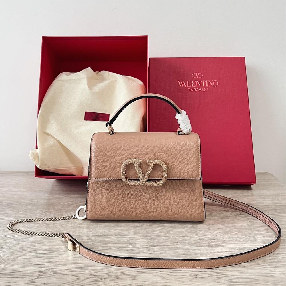 Mini Valentino Garavani VSLINGPaired with an extendable color matching shoulder strap and handle it allows for easy switching between shoulders cros