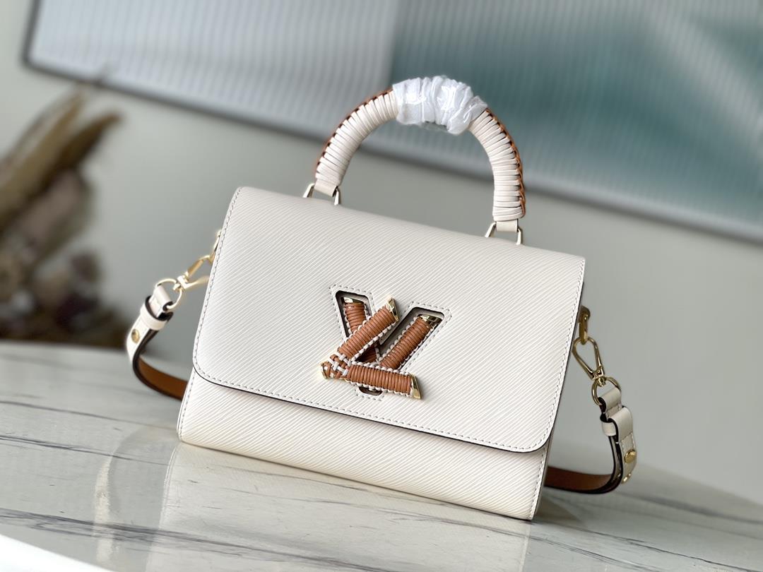 M22236 meter whiteThis Twist medium size handbag is made of Epi embossed leather wrapped in woven l