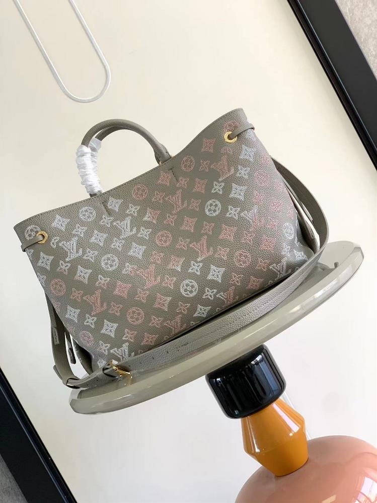 The sleek design and impeccable craftsmanship of the LV M23395 Bella Tote handbag make it