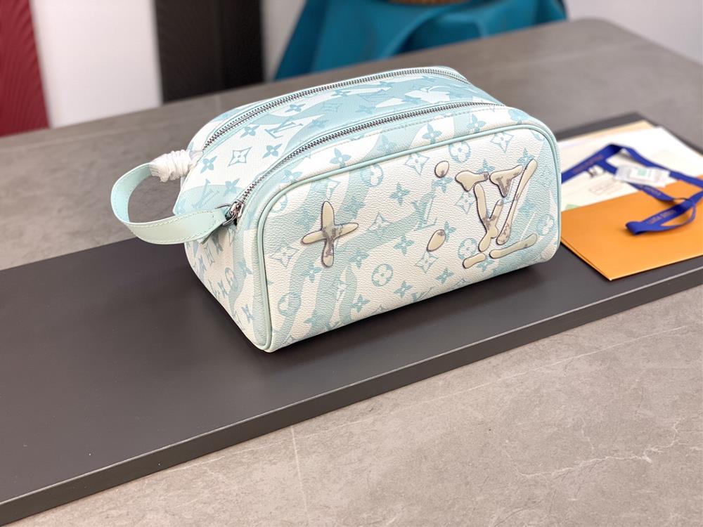 M82337 Drip Glue This Dopp Kit toilet bag is made of Monogram Aquagarden canvas with a threedimensional water droplet effect that reproduces the LV