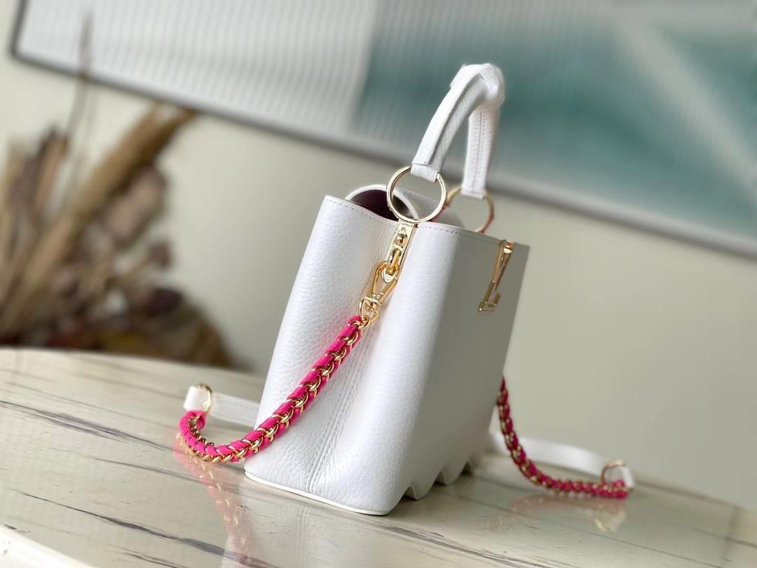 m22121 white waves bottom capushell small handbag is designed with new capucines at the bo