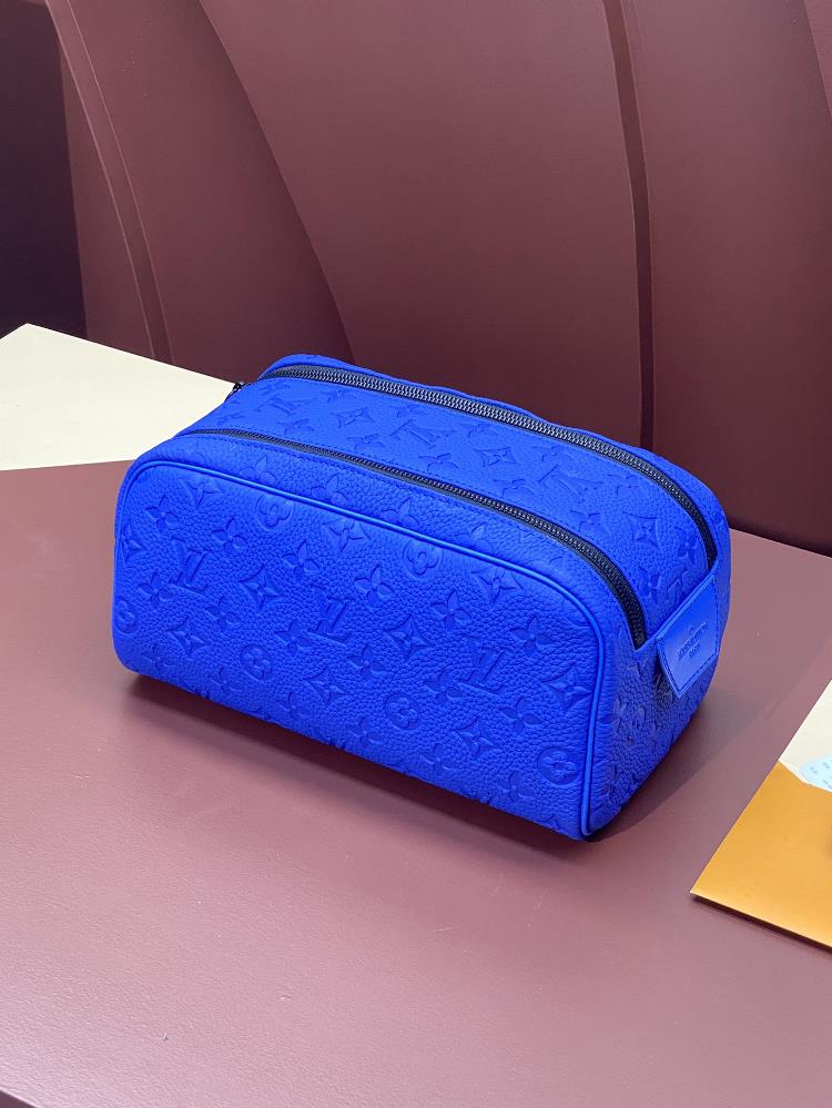 M82576 Blue This colorful top layer cowhide genuine leather the Dopp Kit toilet bag features a grain Taurillon leather embossed Monogram pattern com