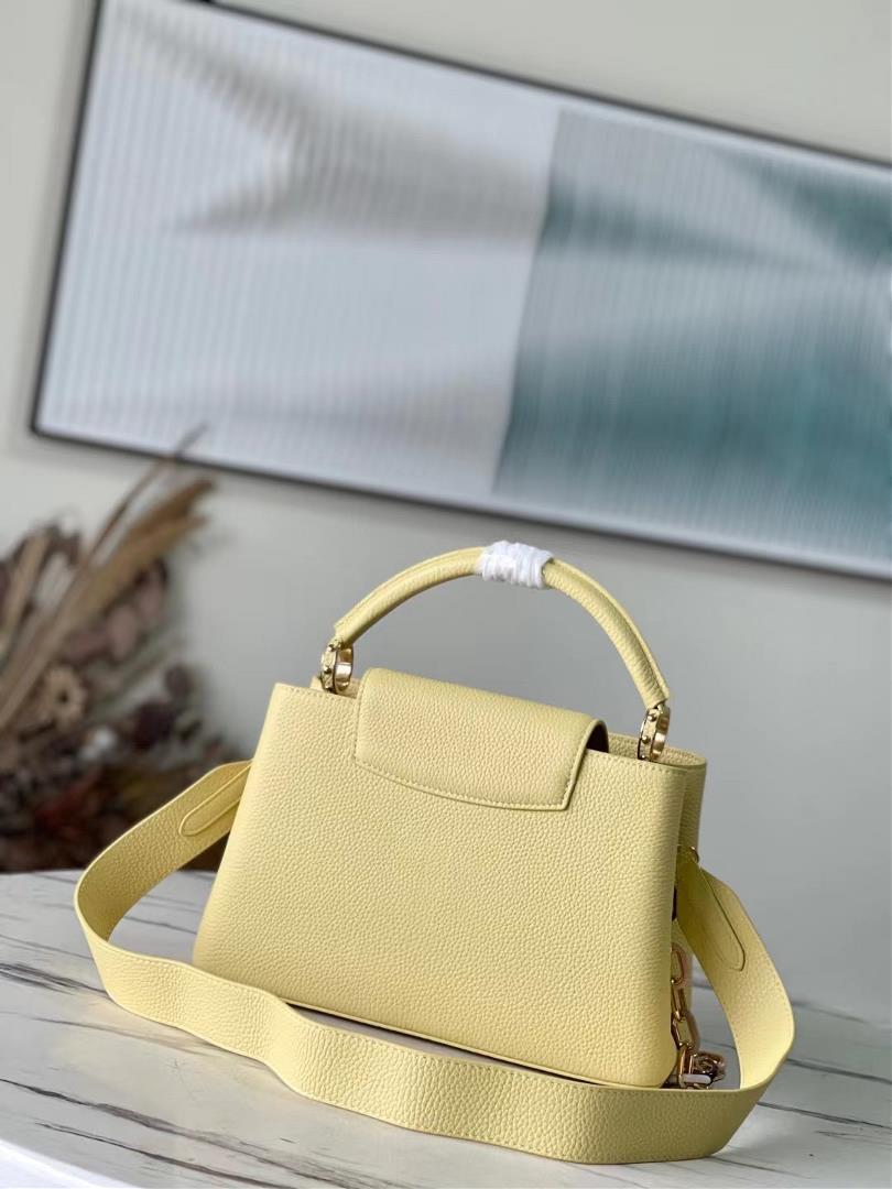 The toplevel original M21798 yellow medium size Capuchines medium size handbag is made of Taur