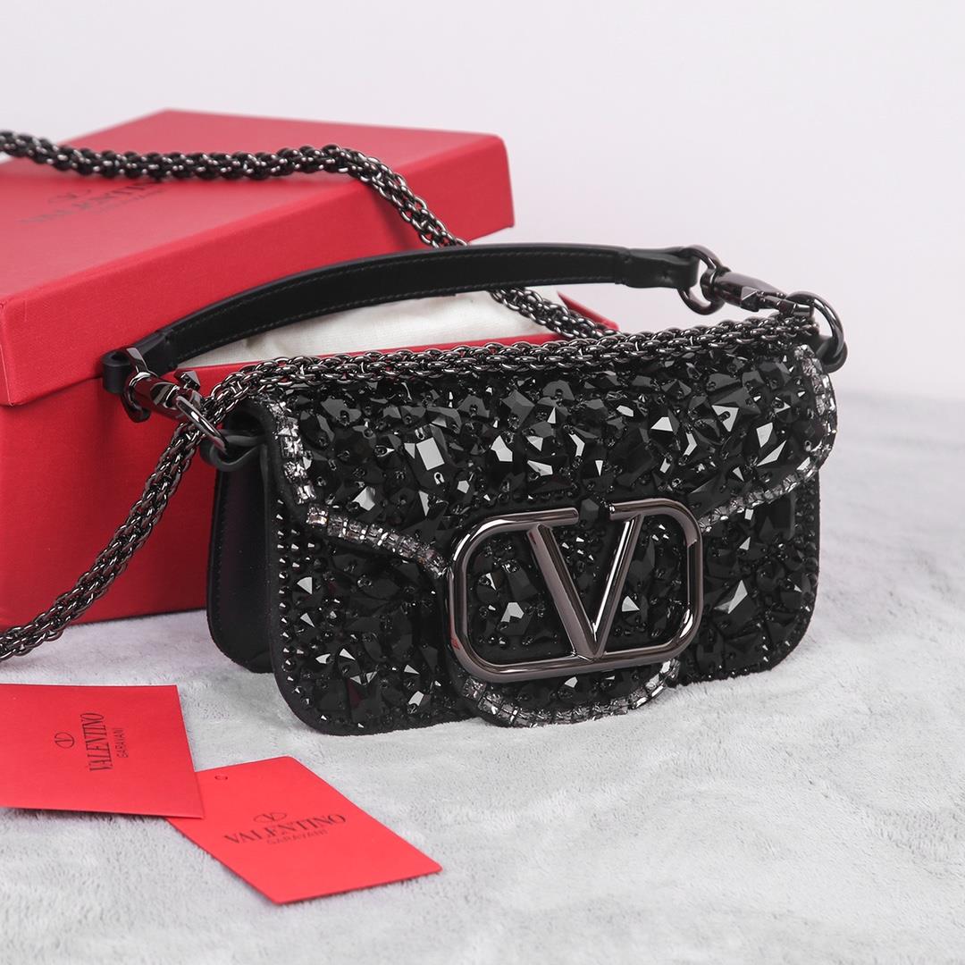 Crystal style The Valentino Garavani Mini Loc handbag is adorned with crystals and Vlogo S