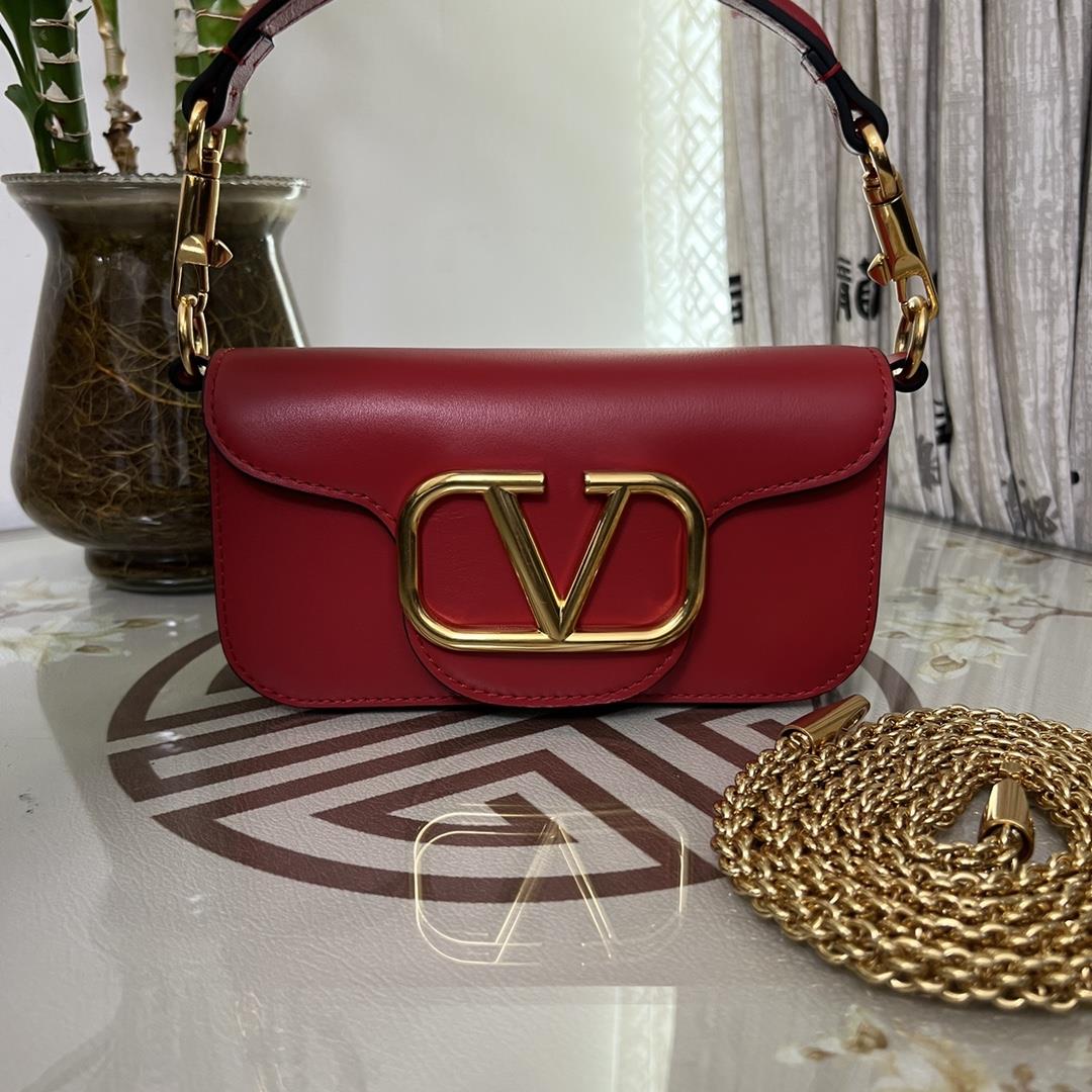 Small Garavani MINI LOC calfskin handbag with metal VLogo Signature detailsEquipped with detachable 