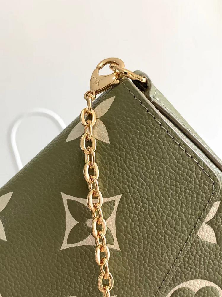 M64064 This Pochette Flice chain pack features a Monogram Imprente leather painted Monogra