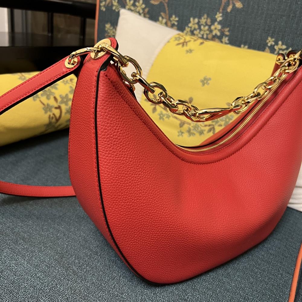 The Valentino Bag with its litchi grain leather and hobo silhouette exudes effortless el