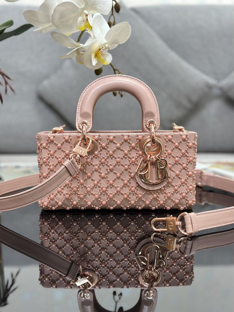 The Lady DJoy horizontal embroidery features half pearl rose gold and a sheepskin lining The handba